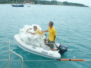 Taking a sail in the dinghy to shore to be folded