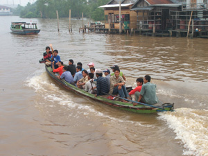 A water taxi, full of people in Banjarmasin, Kalimantan